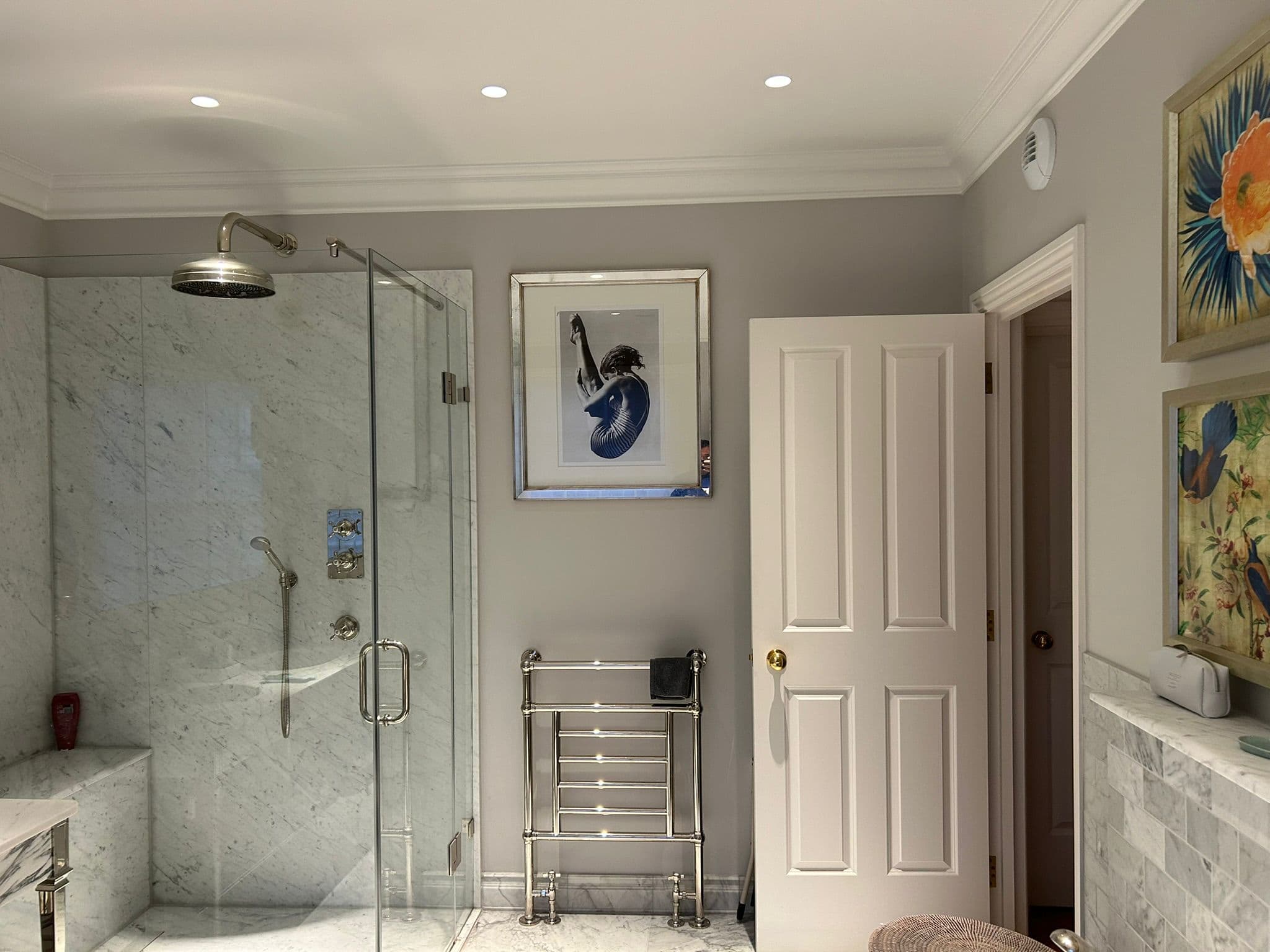 Marble shower room with chrome fittings