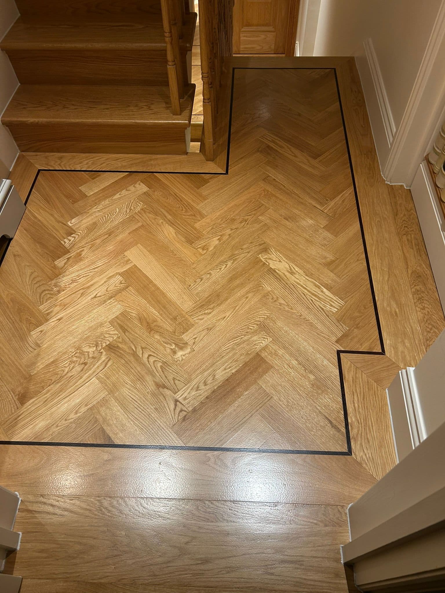 Detailed timber floor finish around a staircase