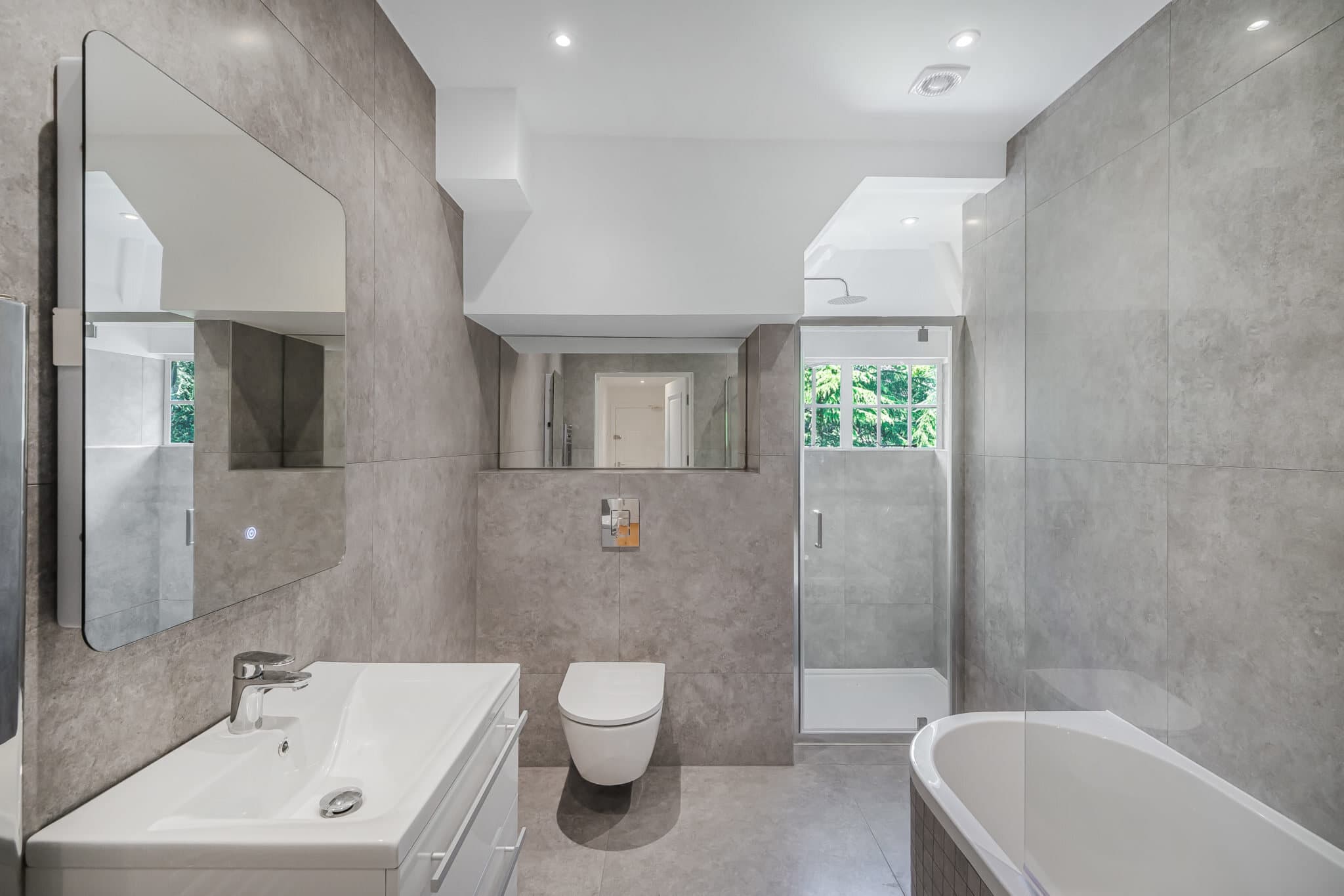 Stone-tiled bathroom with panelled door