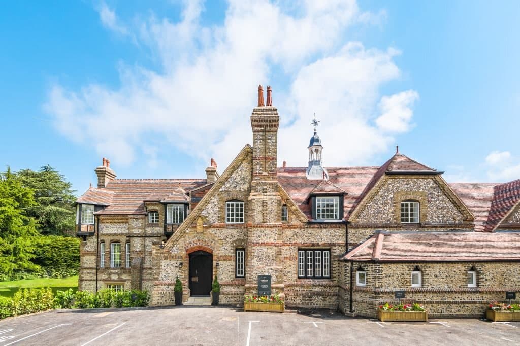 Restored flint and brick facade of a heritage residence